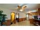 Spacious living room featuring wood paneling and connecting hallways at 1684 Montevista Dr, Shelby, NC 28150