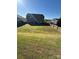 Spacious backyard with lush green lawn, offering plenty of room for recreation and relaxation at 1905 Yellow Daisy Dr, Matthews, NC 28104