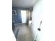Neutral-toned bathroom featuring a step-in shower with glass enclosure and gray tile flooring at 1905 Yellow Daisy Dr, Matthews, NC 28104