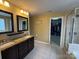 Bathroom with double vanity, granite countertops, and tiled floors at 1905 Yellow Daisy Dr, Matthews, NC 28104