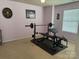 Spacious bedroom featuring neutral carpet, natural light, and a workout area at 1905 Yellow Daisy Dr, Matthews, NC 28104