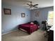 Bedroom featuring a ceiling fan, a large window, and carpeted floor at 1905 Yellow Daisy Dr, Matthews, NC 28104