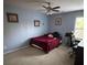 Bedroom with carpet, soft blue walls, natural light, ceiling fan, and desk at 1905 Yellow Daisy Dr, Matthews, NC 28104