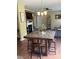Dining area with a marble-topped table, seating for four, and modern light fixture at 1905 Yellow Daisy Dr, Matthews, NC 28104