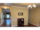 Inviting foyer with hardwood floors, decorative lighting, and open access to living spaces at 1905 Yellow Daisy Dr, Matthews, NC 28104