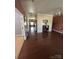 Spacious hallway featuring hardwood floors and neutral wall colors at 1905 Yellow Daisy Dr, Matthews, NC 28104