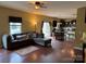 Open-concept living area with hardwood floors, access to the kitchen, and natural light at 1905 Yellow Daisy Dr, Matthews, NC 28104