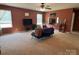 Spacious living room with a ceiling fan, comfortable seating and a mounted television at 1905 Yellow Daisy Dr, Matthews, NC 28104