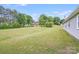 Spacious backyard featuring a well-maintained lawn and mature trees, perfect for outdoor activities and relaxation at 218 Valleybrook Ln, Troutman, NC 28166