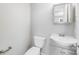 Bright bathroom with a toilet and a mirror over sink at 218 Valleybrook Ln, Troutman, NC 28166
