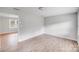 Bright bedroom featuring new vinyl floors and an abundance of natural light at 218 Valleybrook Ln, Troutman, NC 28166