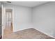 The spacious bedroom has wood-look floors and neutral walls at 218 Valleybrook Ln, Troutman, NC 28166