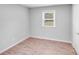 Bright bedroom features sleek wood floors and a window at 218 Valleybrook Ln, Troutman, NC 28166