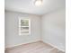 Bedroom with light walls and a window overlooking a yard at 218 Valleybrook Ln, Troutman, NC 28166