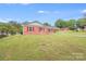 Single story house with a driveway and green grass at 218 Valleybrook Ln, Troutman, NC 28166