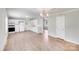 Open kitchen with white cabinets, modern appliances, and new vinyl flooring for a fresh look at 218 Valleybrook Ln, Troutman, NC 28166