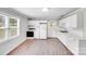 Bright kitchen with ample counter space, white cabinets, and new appliances for easy cooking at 218 Valleybrook Ln, Troutman, NC 28166
