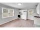 Well-lit kitchen features white cabinets, modern appliances, and updated flooring for a clean design at 218 Valleybrook Ln, Troutman, NC 28166