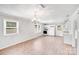 Modern kitchen with white cabinetry, updated appliances, and new vinyl flooring for a sleek design at 218 Valleybrook Ln, Troutman, NC 28166