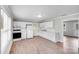 Bright kitchen with white cabinets, updated appliances, and modern countertops for a fresh design at 218 Valleybrook Ln, Troutman, NC 28166