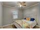 Comfortable bedroom features carpeted floors, neutral colored walls, and a ceiling fan at 221 Delview Dr, Cherryville, NC 28021