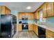 Functional kitchen with light wood cabinets, modern appliances, and ample counter space for meal preparation at 221 Delview Dr, Cherryville, NC 28021