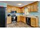 Well-equipped kitchen featuring wooden cabinetry, modern appliances, and plenty of room for cooking and storage at 221 Delview Dr, Cherryville, NC 28021