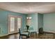 Bright living area featuring wood floors, French doors to the backyard, and casual seating for relaxing indoors at 221 Delview Dr, Cherryville, NC 28021