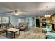 Cozy living room showcasing hardwood floors, and comfortable seating adjacent to the open-concept kitchen at 221 Delview Dr, Cherryville, NC 28021