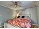 Comfortable bedroom with stylish bedding, fan, and hardwood floors, creating a relaxing retreat for rest and relaxation at 221 Delview Dr, Cherryville, NC 28021