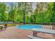 Backyard pool with surrounding deck and seating, perfect for outdoor entertaining at 221 Delview Dr, Cherryville, NC 28021