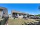 Backyard view with fenced perimeter, small fire pit and screened porch at 2333 Talon Point Cir, Fort Mill, SC 29715