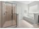 Bathroom featuring glass shower and soaking tub at 2333 Talon Point Cir, Fort Mill, SC 29715