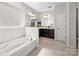 Bathroom features a soaking tub and double vanity with dark wood cabinetry and framed mirrors at 2333 Talon Point Cir, Fort Mill, SC 29715
