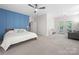 Spacious bedroom with an accent wall, neutral carpet, ceiling fan, and a private balcony access at 2333 Talon Point Cir, Fort Mill, SC 29715