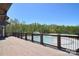 Spacious wood deck overlooking a sparkling pool and lush, mature trees at 2333 Talon Point Cir, Fort Mill, SC 29715