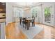 Bright dining room with a modern light fixture, large windows, and access to the outdoors at 2333 Talon Point Cir, Fort Mill, SC 29715