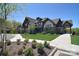 Stunning two-story home featuring manicured lawn, covered side entrance, and professional landscaping at 2333 Talon Point Cir, Fort Mill, SC 29715