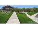 Picturesque community grounds with walkways, lush landscaping, and view of the community pool at 2333 Talon Point Cir, Fort Mill, SC 29715