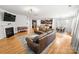 Open floor plan featuring a living room with fireplace flowing into the kitchen and dining area at 2333 Talon Point Cir, Fort Mill, SC 29715