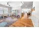 Open-concept living space with hardwood floors and view to dining and stairs at 2333 Talon Point Cir, Fort Mill, SC 29715