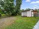 View of the one car garage and gravel parking area at 268 Jefferson Ne Ct, Concord, NC 28025
