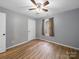 Cozy bedroom with hardwood floors, neutral paint, and ample natural light from window at 268 Jefferson Ne Ct, Concord, NC 28025