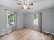 This light and bright bedroom has two windows and neutral-colored walls at 268 Jefferson Ne Ct, Concord, NC 28025