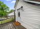 Charming home entrance with covered porch, white siding, a 'Welcome Home' doormat, and stylish details at 268 Jefferson Ne Ct, Concord, NC 28025