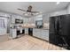 Modern kitchen featuring grey cabinets, stainless steel appliances, and hardwood flooring at 268 Jefferson Ne Ct, Concord, NC 28025
