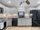 Updated kitchen with stainless appliances, gray cabinets and modern fixtures, ready for cooking at 268 Jefferson Ne Ct, Concord, NC 28025