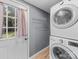 This laundry room has a door to the backyard and a shelving rack at 268 Jefferson Ne Ct, Concord, NC 28025