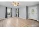 Inviting living room featuring new floors, neutral paint, and an elegant front door at 268 Jefferson Ne Ct, Concord, NC 28025