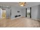Bright and airy living room with modern flooring, a ceiling fan, and lots of natural light at 268 Jefferson Ne Ct, Concord, NC 28025